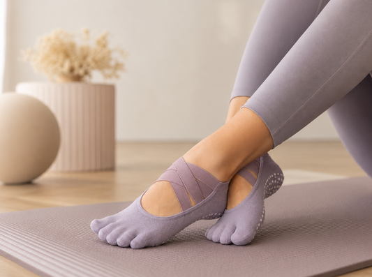 Pilates grip socks for beginners on a studio mat
